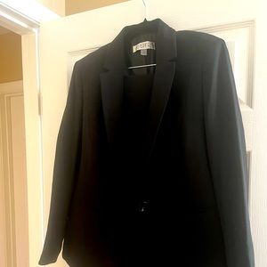 Kasper black women’s skirt suit. Size 12, fully lined. Never worn.